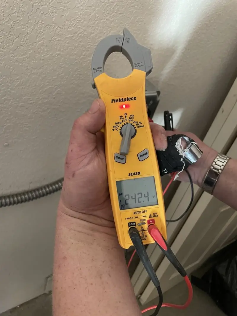Voltage testing with clamp meter during Electrical Installation Services in River Road